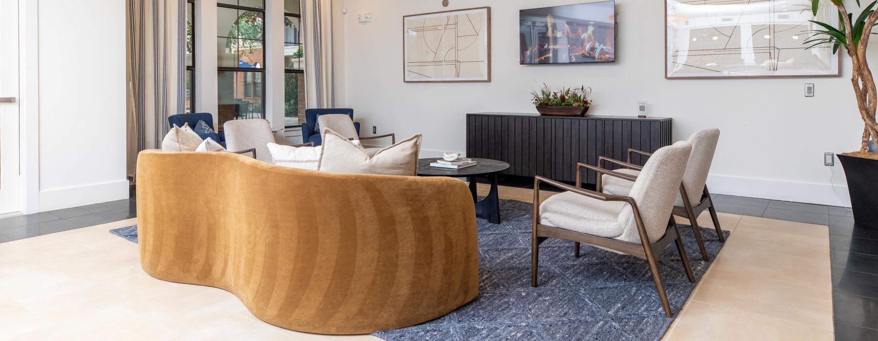 a living room with a chandelier and a couch