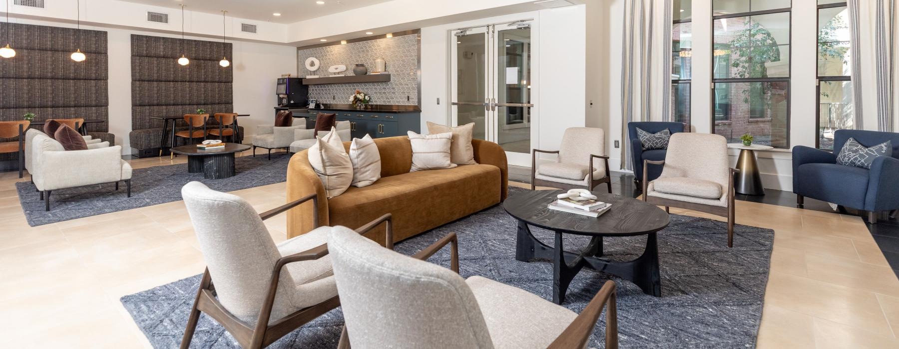 a large living room with a chandelier and a large glass door