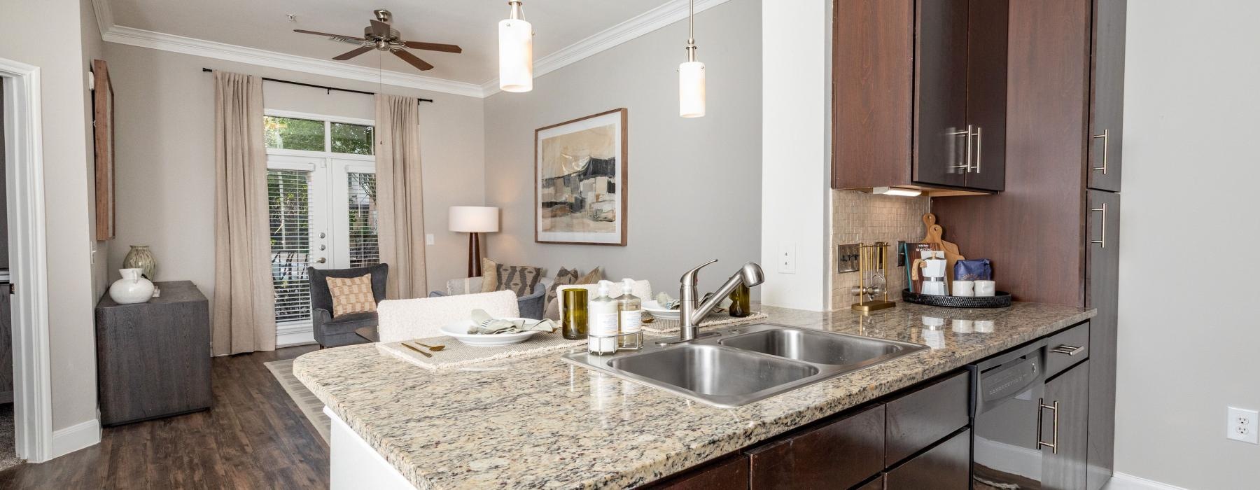 a kitchen with marble counters